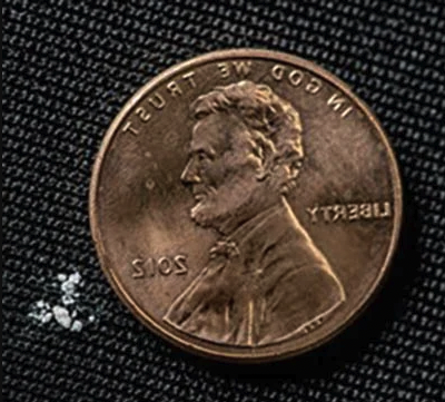 photo of lethal dose of fentanyl on a USA penny